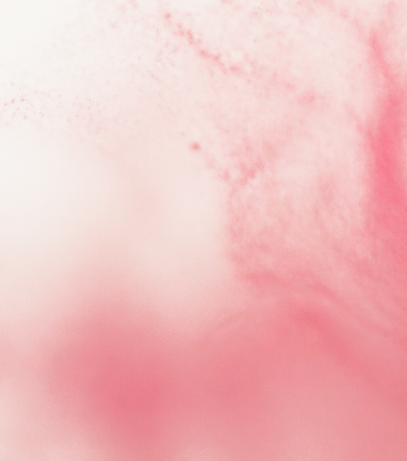 A close-up of a soft pink textured surface with fine speckling and cloudy tonal variation, filling the frame.